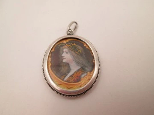 Double-sided picture frame pendant. Sterling silver. Cord motif edge. 1980's