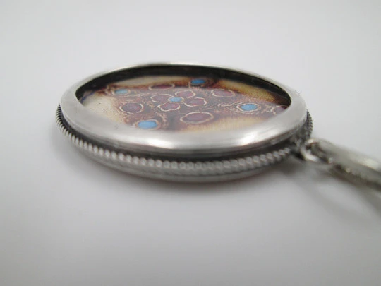 Double-sided picture frame pendant. Sterling silver. Cord motif edge. 1980's