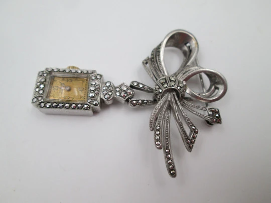 Dulux women's pendant watch. Rhodium plated metal. Sterling silver brooch. 1940's