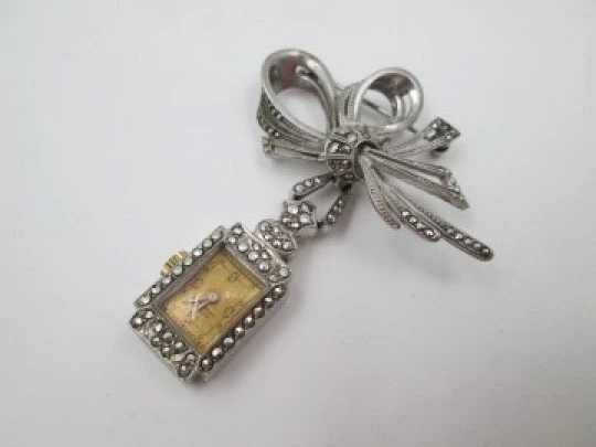 Dulux women's pendant watch. Rhodium plated metal. Sterling silver brooch. 1940's