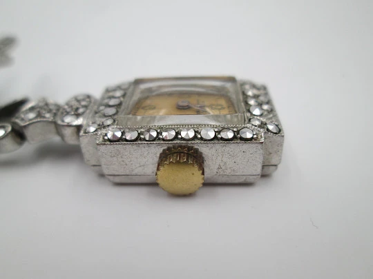 Dulux women's pendant watch. Rhodium plated metal. Sterling silver brooch. 1940's