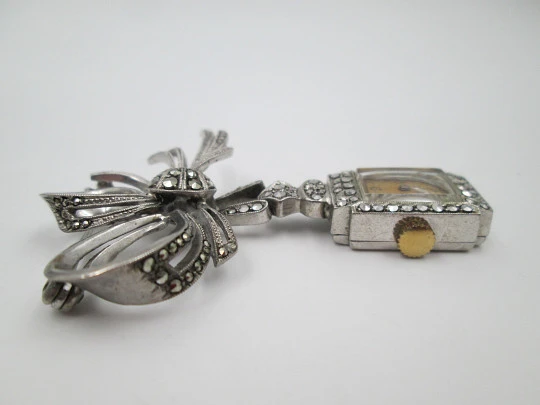 Dulux women's pendant watch. Rhodium plated metal. Sterling silver brooch. 1940's