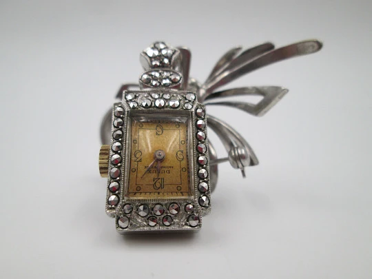 Dulux women's pendant watch. Rhodium plated metal. Sterling silver brooch. 1940's