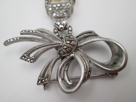 Dulux women's pendant watch. Rhodium plated metal. Sterling silver brooch. 1940's