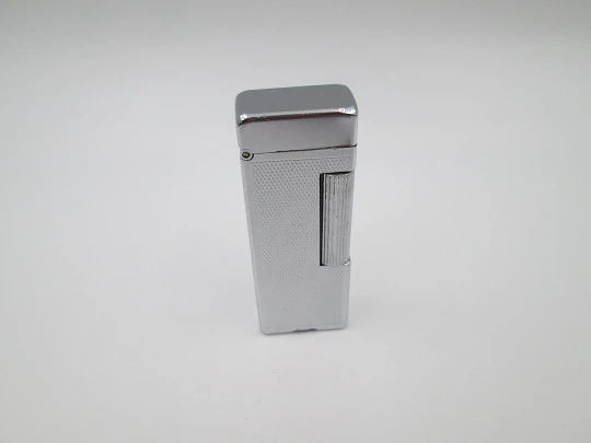 Dunhill Rollalite petrol pocket lighter. Silver laminated. Rhomboid pattern. Swiss. 1950's Dunhill Rollalite petrol pocket lighter. Silver laminated. Rhomboid pattern. Swiss. 1950's