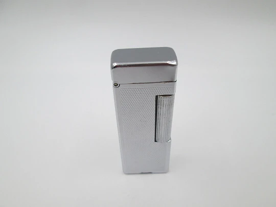 Dunhill Rollalite petrol pocket lighter. Silver laminated. Rhomboid pattern. Swiss. 1950's Dunhill Rollalite petrol pocket lighter. Silver laminated. Rhomboid pattern. Swiss. 1950's