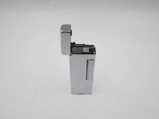 Dunhill Rollalite petrol pocket lighter. Silver laminated. Rhomboid pattern. Swiss. 1950's Dunhill Rollalite petrol pocket lighter. Silver laminated. Rhomboid pattern. Swiss. 1950's