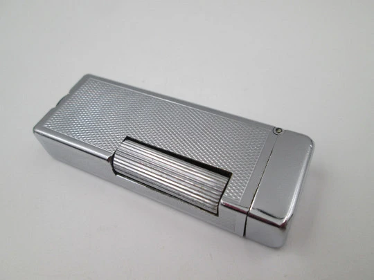 Dunhill Rollalite petrol pocket lighter. Silver laminated. Rhomboid pattern. Swiss. 1950's Dunhill Rollalite petrol pocket lighter. Silver laminated. Rhomboid pattern. Swiss. 1950's
