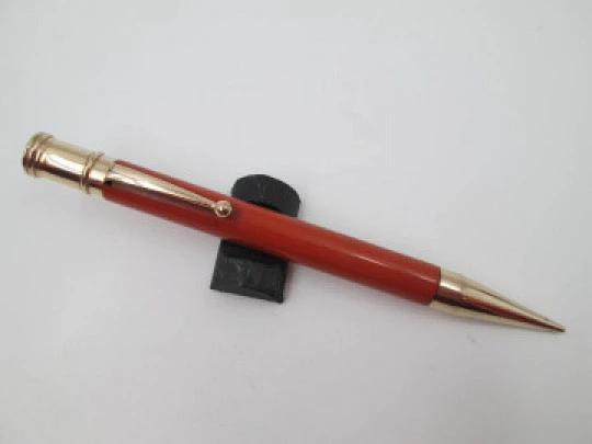 Dunlop Fort mechanical pencil. Orange celluloid & gold plated. England. 1920's