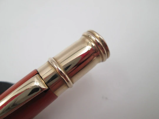 Dunlop Fort mechanical pencil. Orange celluloid & gold plated. England. 1920's