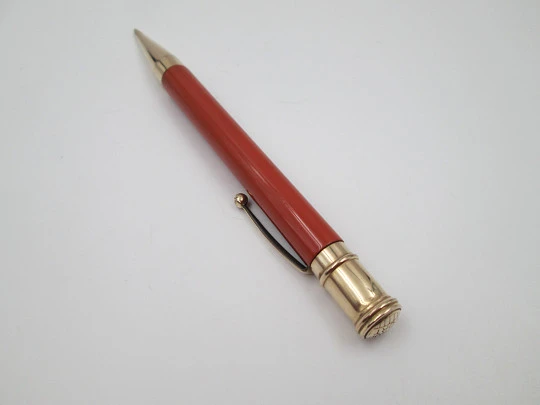 Dunlop Fort mechanical pencil. Orange celluloid & gold plated. England. 1920's