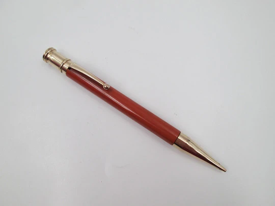 Dunlop Fort mechanical pencil. Orange celluloid & gold plated. England. 1920's