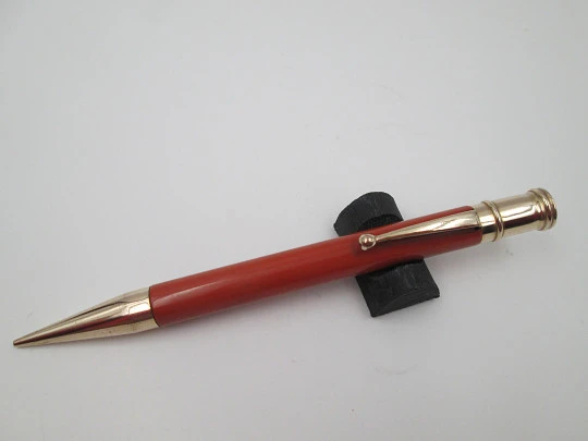 Dunlop Fort mechanical pencil. Orange celluloid & gold plated. England. 1920's