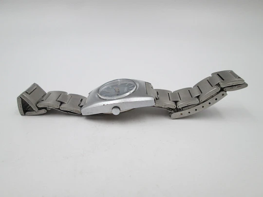 Duward Internat reloj unisex. Metal niquelado y acero. Dial azul. Calendario. Brazalete. 1970