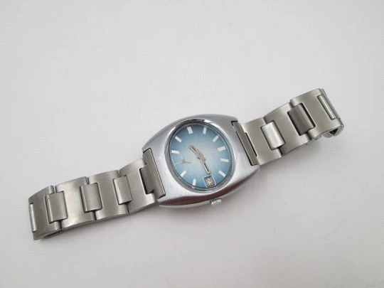 Duward Internat reloj unisex. Metal niquelado y acero. Dial azul. Calendario. Brazalete. 1970