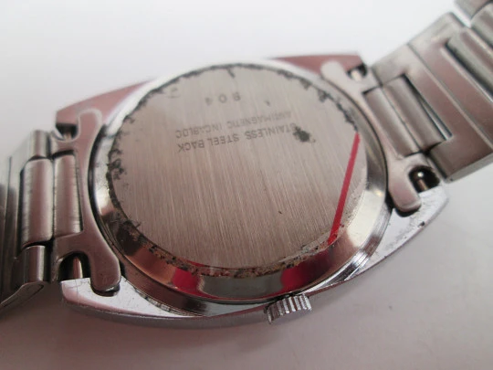 Duward Internat reloj unisex. Metal niquelado y acero. Dial azul. Calendario. Brazalete. 1970