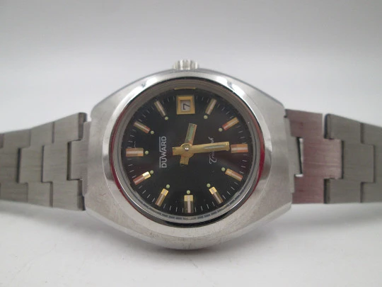 Duward Triumph mujer. Acero inoxidable. Cuerda manual. Calendario. Brazalete. 1970