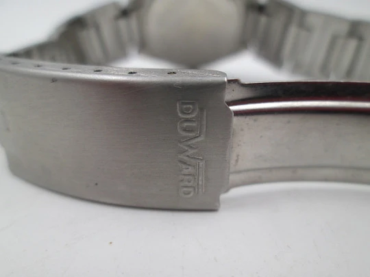 Duward women's watch. Stainless steel. Bitone dial. Calendar. Manual wind. Bracelet. 1970's