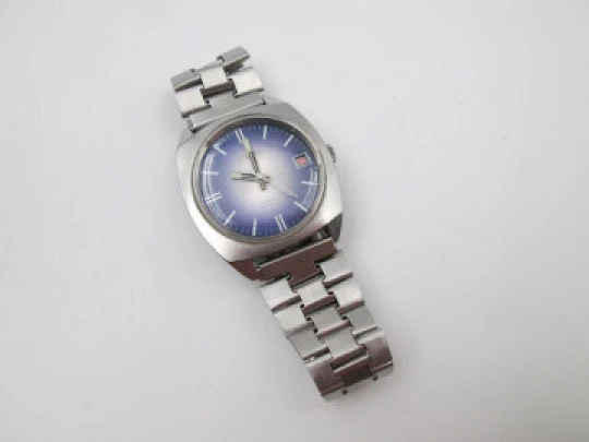 Duward. Acero inoxidable. Dial tornasolado azul gris. Calendario. Brazalete. 1970