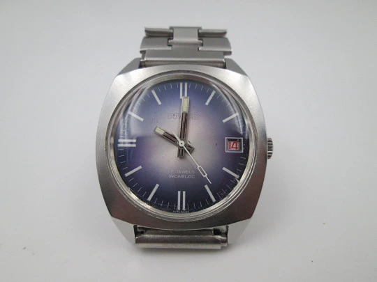 Duward. Acero inoxidable. Dial tornasolado azul gris. Calendario. Brazalete. 1970