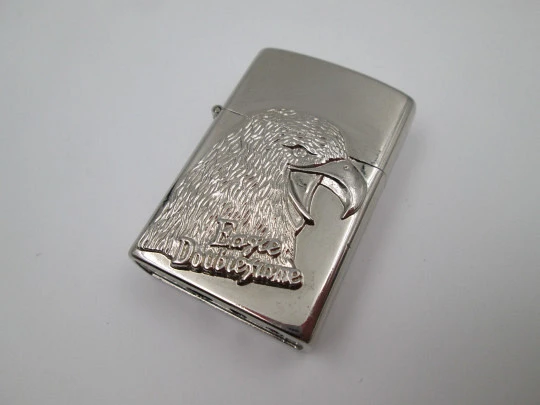 Eagle Double Flame butane torch pocket lighter with bird relief motif. Chromed plated