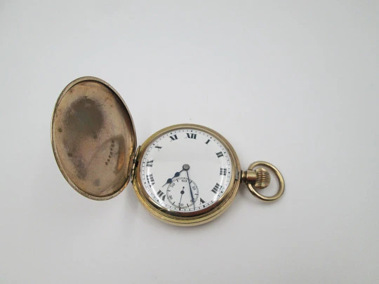 Elgin hunter-case pocket watch with chain. Gold plated. Stem-wind. Porcelain dial. 1930's
