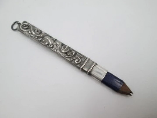 Embossed sterling silver pencil. Floral & vegetable motifs. England. 1900's