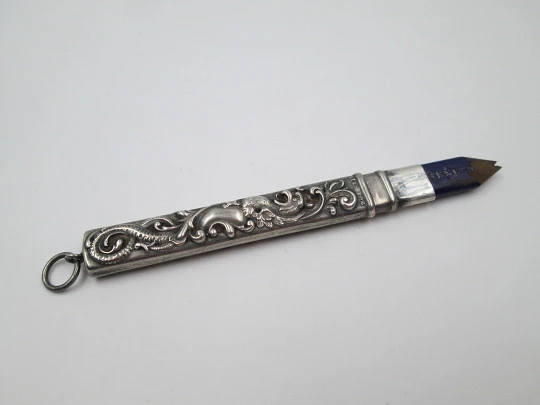 Embossed sterling silver pencil. Floral & vegetable motifs. England. 1900's