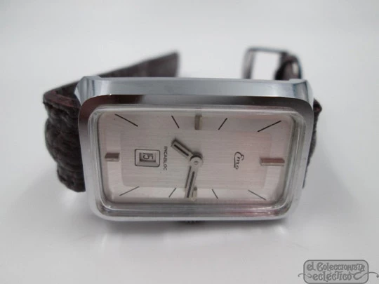 Emo. Steel & chromed metal. Rectangular case. Manual wind. Date. Swiss