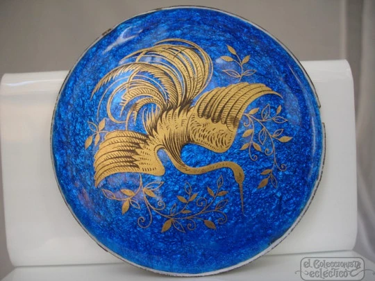 Enamel on copper. Circular shape. Gold crane bird. Blue background