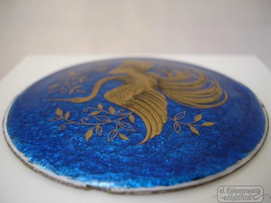 Enamel on copper. Circular shape. Gold crane bird. Blue background