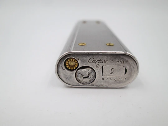 Encendedor a gas Cartier París Santos. Chapado en plata y detalles oro. 1980. Suiza Encendedor a gas Cartier París Santos. Chapado en plata y detalles oro. 1980. Suiza