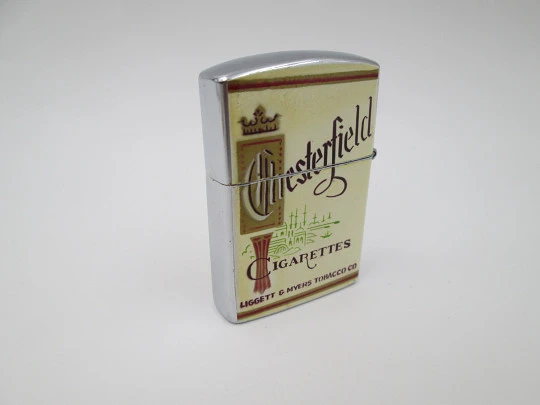 Encendedor Continental. Cigarrillos Chesterfield. Metal cromado. Caja. Japón. 1980