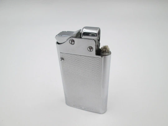 Encendedor de bolsillo automático a gasolina Benlow Master. Metal plateado. Caja. 1950 Encendedor de bolsillo automático a gasolina Benlow Master. Metal plateado. Caja. 1950