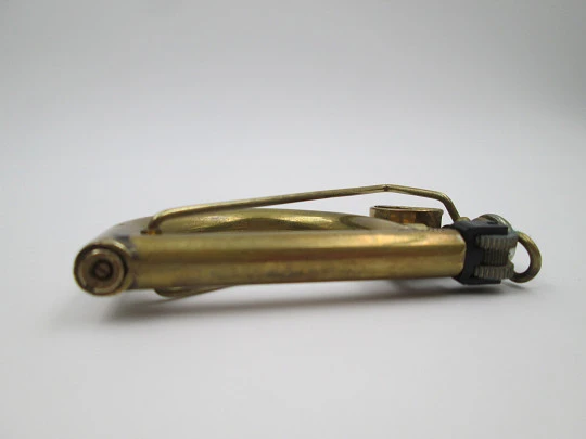 Encendedor de bolsillo de mecha Ritter. Metal dorado. Forma de arpa. 1970. Alemania