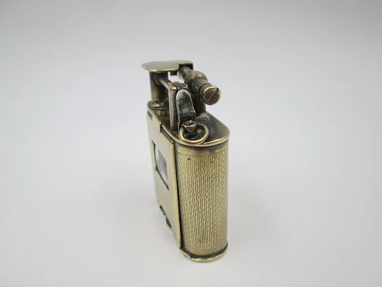 Encendedor de gasolina Corona con reloj mecánico Atlantic. Metal dorado. 1940 Encendedor de gasolina Corona con reloj mecánico Atlantic. Metal dorado. 1940