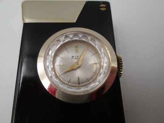 Encendedor gasolina / reloj mecánico Rivo. Metal lacado negro y chapado oro. Suiza. 1960