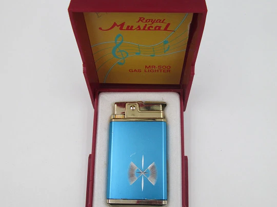 Encendedor musical a gas Royal MR-500. Metal bicolor. Caja. Regulador de llama. Japón. 1960