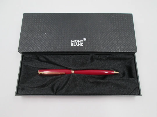 Esferógrafo Montblanc Generation. Resina granate y chapados oro. Giratorio. Caja. 1990