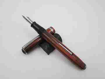 Esterbrook. Model J. Red marbled celluloid. Lever filler. Steel nib. 1940