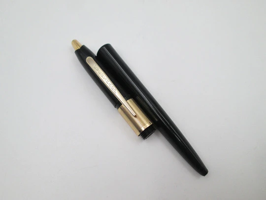 Eversharp ball point pen. Black plastic and gold plated. Push button system. 1950's. USA