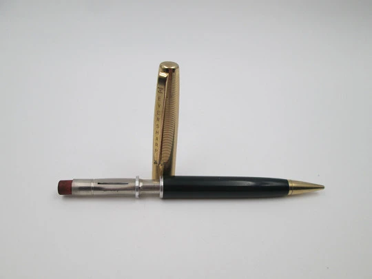 Eversharp. Green plastic body and gold plated cap. Push mechanism. 1950's. USA