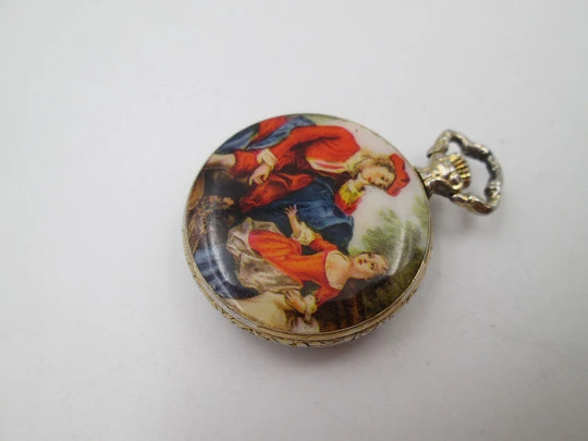 Exactus pendant watch. Gold plated. Manual wind. Romantic scene enamel on back. 1970's Exactus pendant watch. Gold plated. Manual wind. Romantic scene enamel on back. 1970's
