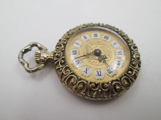 Exactus pendant watch. Gold plated. Manual wind. Romantic scene enamel on back. 1970's Exactus pendant watch. Gold plated. Manual wind. Romantic scene enamel on back. 1970's