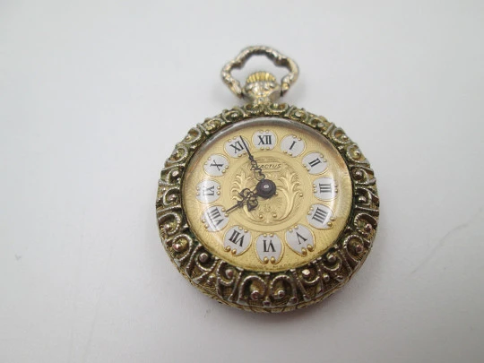 Exactus pendant watch. Gold plated. Manual wind. Romantic scene enamel on back. 1970's Exactus pendant watch. Gold plated. Manual wind. Romantic scene enamel on back. 1970's