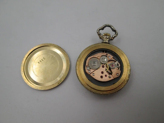 Exactus pendant watch. Gold plated. Manual wind. Romantic scene enamel on back. 1970's Exactus pendant watch. Gold plated. Manual wind. Romantic scene enamel on back. 1970's