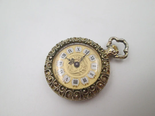 Exactus pendant watch. Gold plated. Manual wind. Romantic scene enamel on back. 1970's Exactus pendant watch. Gold plated. Manual wind. Romantic scene enamel on back. 1970's