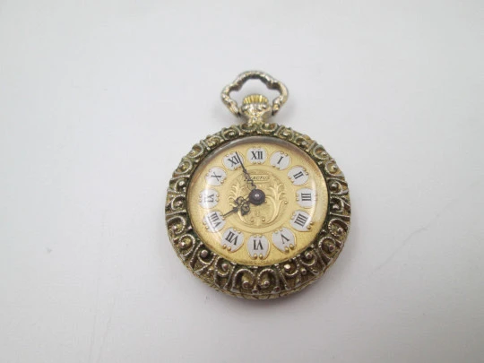 Exactus pendant watch. Gold plated. Manual wind. Romantic scene enamel on back. 1970's Exactus pendant watch. Gold plated. Manual wind. Romantic scene enamel on back. 1970's