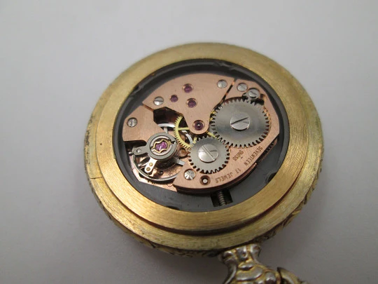 Exactus pendant watch. Gold plated. Manual wind. Romantic scene enamel on back. 1970's Exactus pendant watch. Gold plated. Manual wind. Romantic scene enamel on back. 1970's