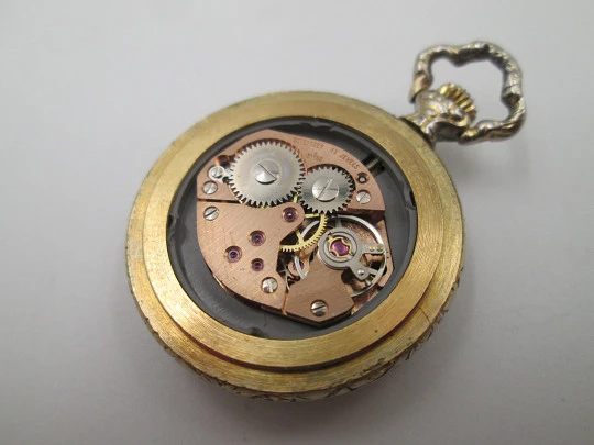 Exactus pendant watch. Gold plated. Manual wind. Romantic scene enamel on back. 1970's Exactus pendant watch. Gold plated. Manual wind. Romantic scene enamel on back. 1970's